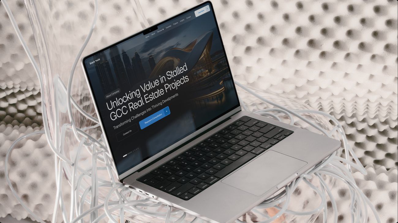 Black Mule website on a laptop: 'Unlocking value in stalled GCC real estate projects'