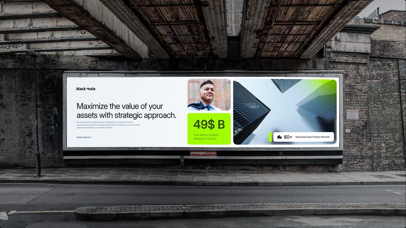 Round 01, Concept 01: the mule monogram in lime, on an underpass billboard.