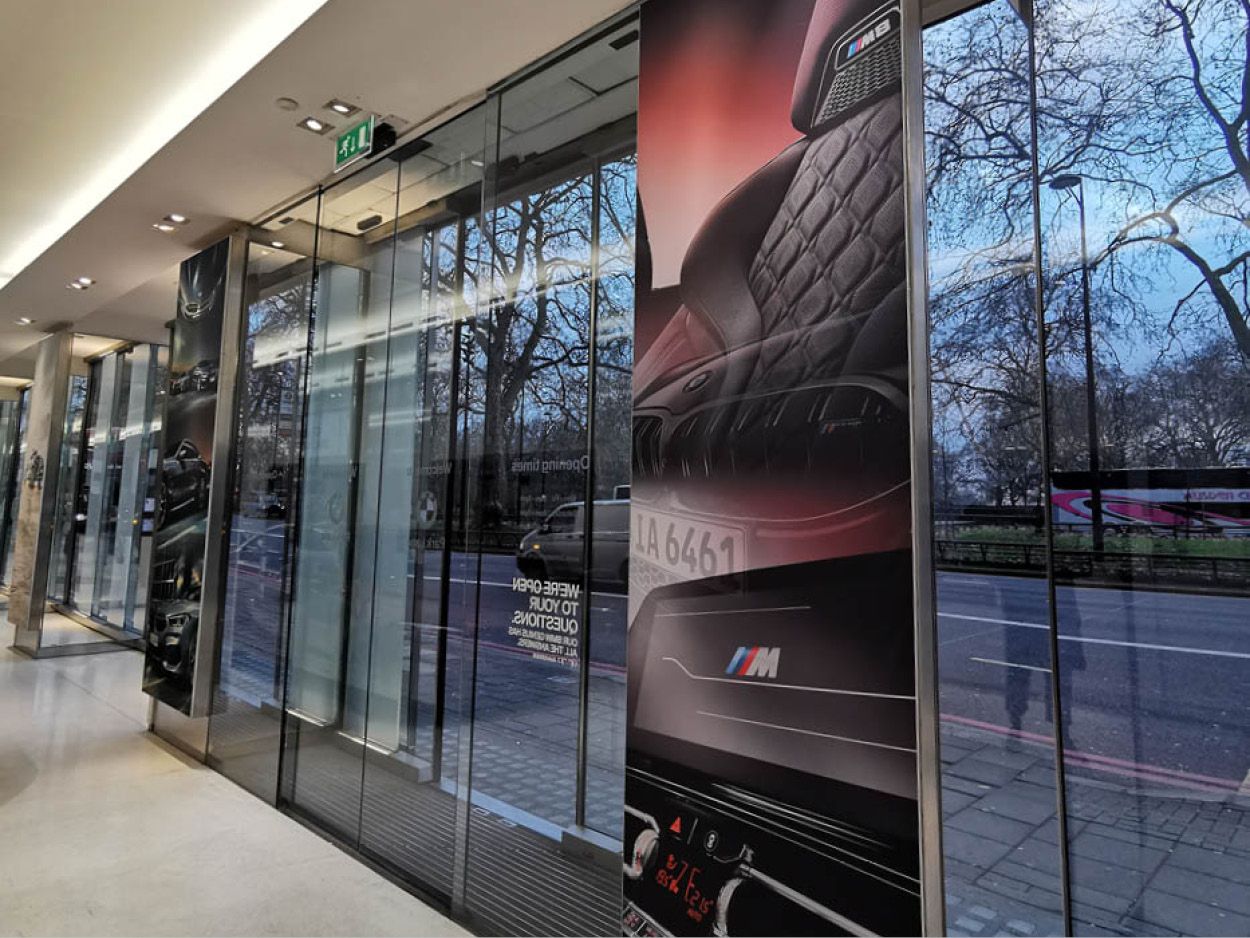 BMW M interior artwork at the showroom entrance.